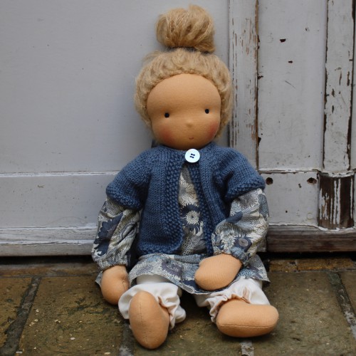 Waldorf doll girl in liberty dress, blueish cardigan, blond hair, made by feinslieb