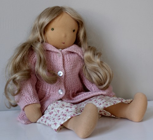 Waldorf doll with human hair and pink cardigan
